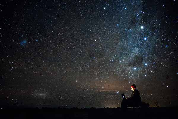 No Office Required: Digital nomad working under open night sky