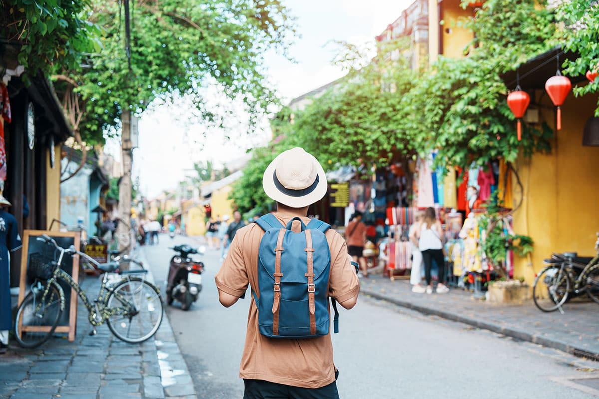 guy immersive travel walking through town