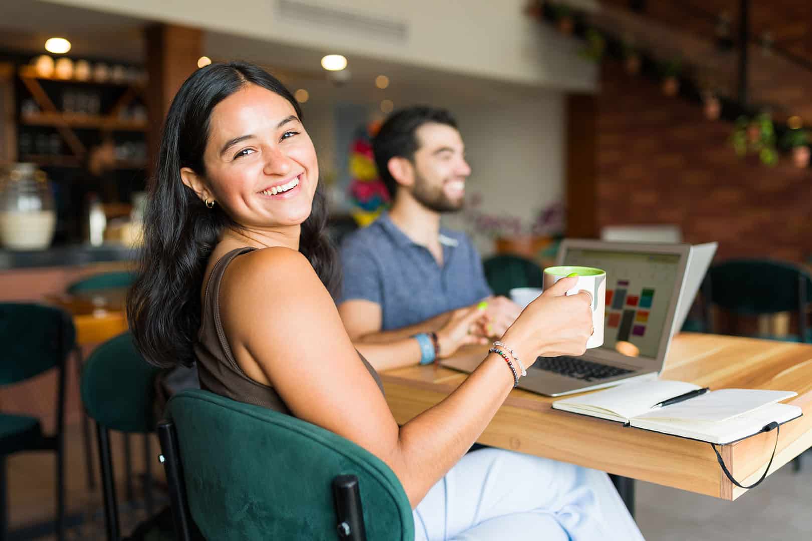 happy woman remote work cafe