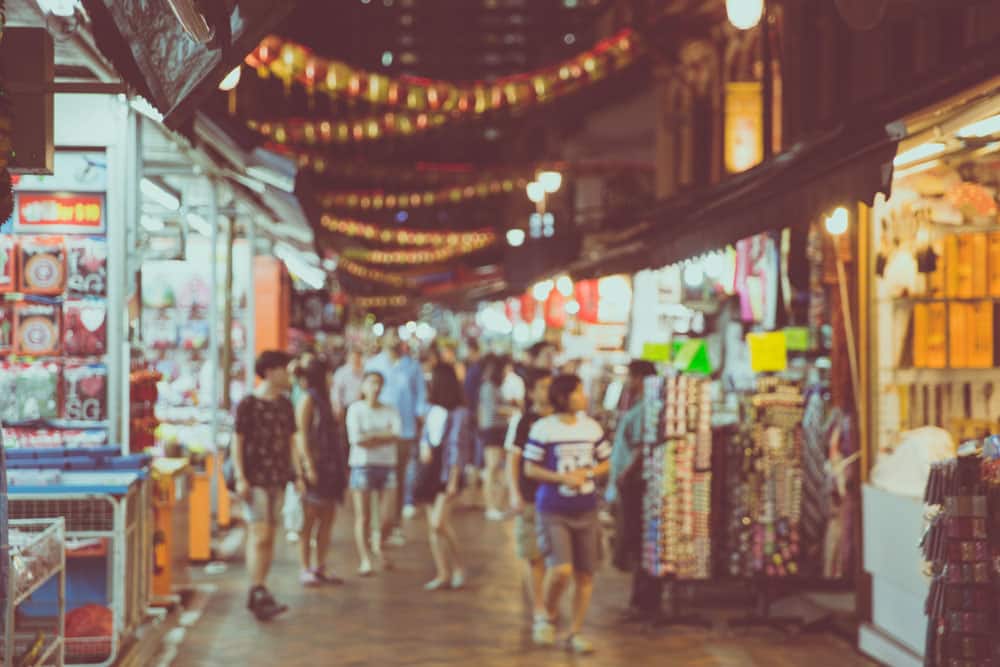 Abstract,Blur,Crowds,Walk,Through,A,Chinatown,Market,At,Night chinatown night market